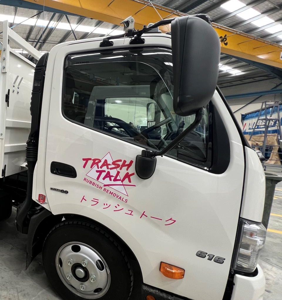Trash Talk truck cab with the neon logo and Japanese katakana on the door